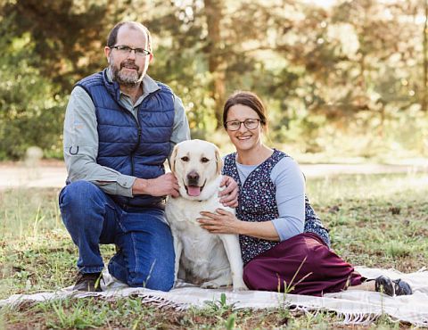 Craig & Mariska with a yellow Labrador.
