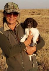 Me, holding a spaniel puppy